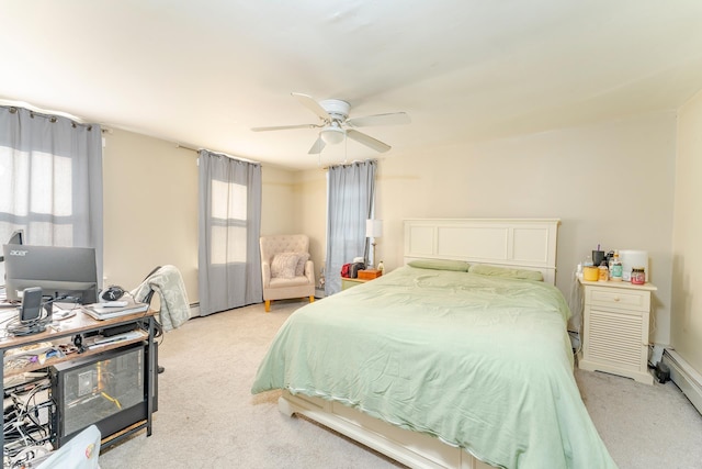 carpeted bedroom with ceiling fan and a baseboard heating unit