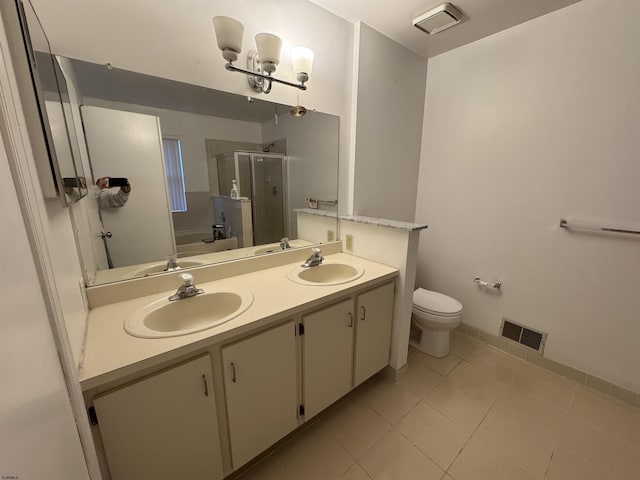 full bathroom featuring tile patterned floors, a chandelier, toilet, vanity, and shower with separate bathtub