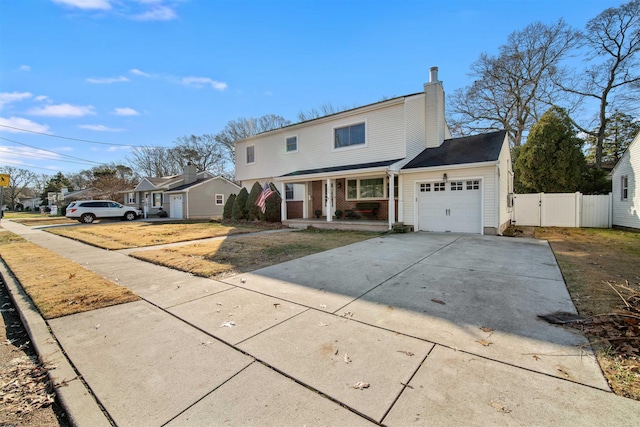 view of front of property featuring a porch and a garage