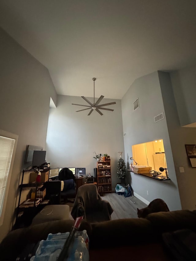 living room with hardwood / wood-style flooring and ceiling fan