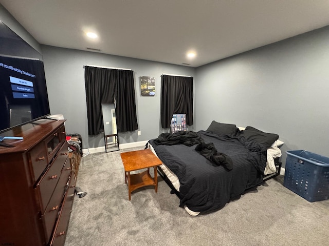 bedroom featuring light carpet