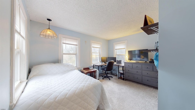 carpeted bedroom with a textured ceiling