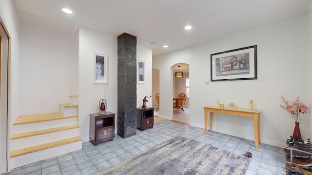 hall featuring light tile patterned flooring