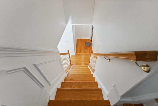 stairs with hardwood / wood-style floors