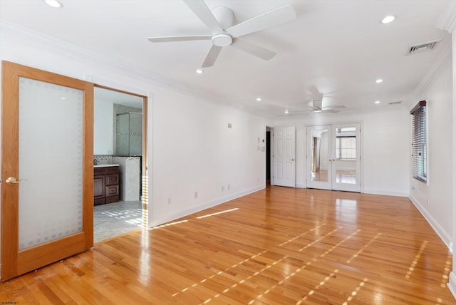 unfurnished room featuring ceiling fan, light hardwood / wood-style floors, and french doors