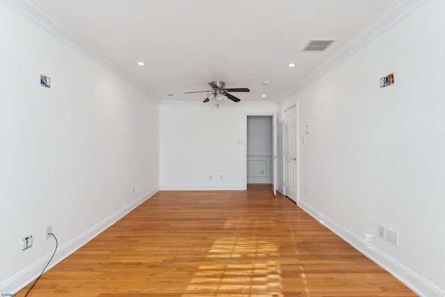 spare room with ceiling fan, light hardwood / wood-style floors, and ornamental molding