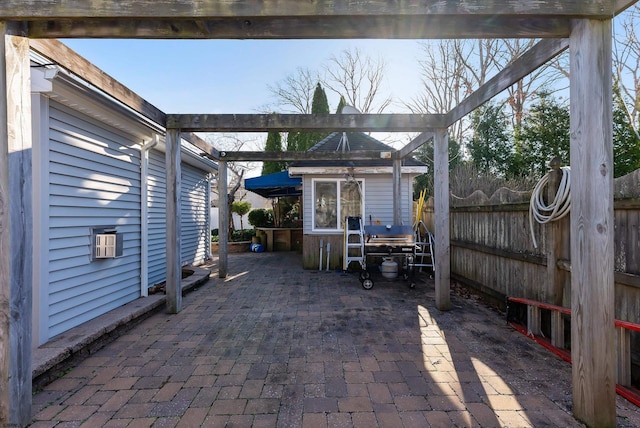 view of patio with an outbuilding