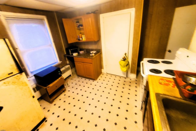 kitchen featuring radiator and sink