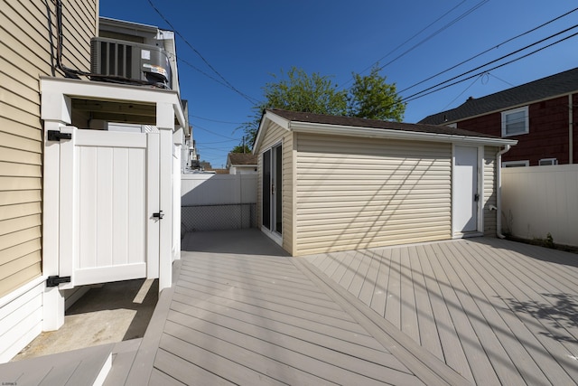 wooden terrace featuring central air condition unit