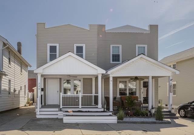 view of front of house featuring ceiling fan and covered porch