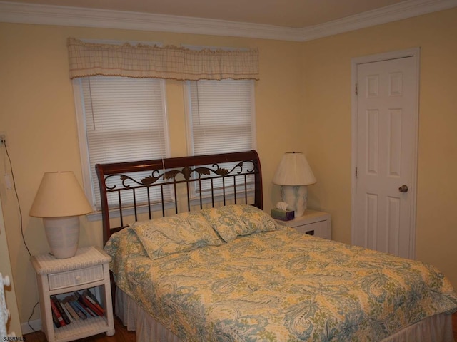 bedroom featuring crown molding