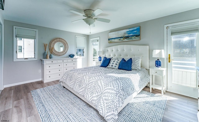 bedroom with ceiling fan and hardwood / wood-style flooring