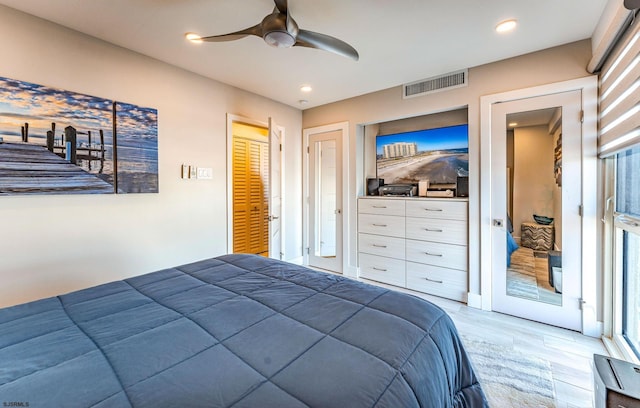 bedroom featuring ceiling fan and hardwood / wood-style flooring