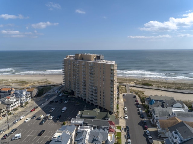 bird's eye view featuring a water view and a view of the beach