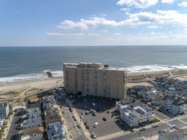 aerial view with a water view and a view of the beach