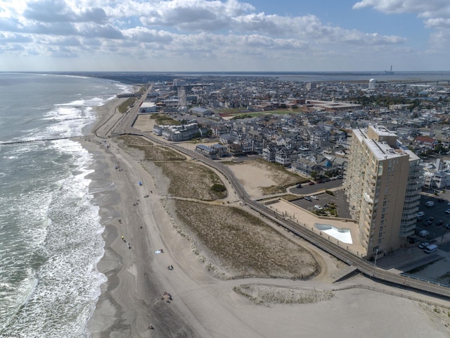 aerial view featuring a water view and a beach view