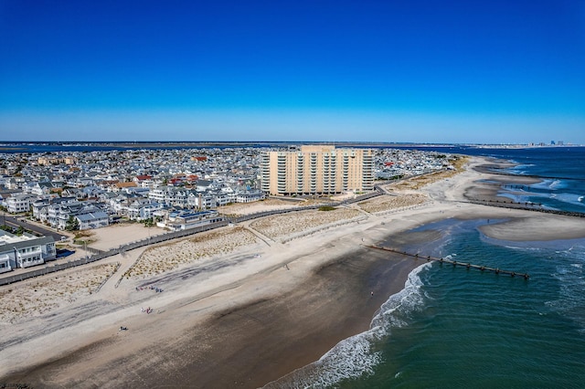 bird's eye view featuring a water view and a view of the beach