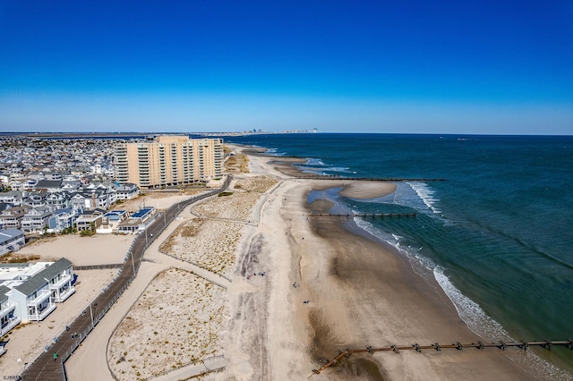 aerial view with a view of the beach and a water view