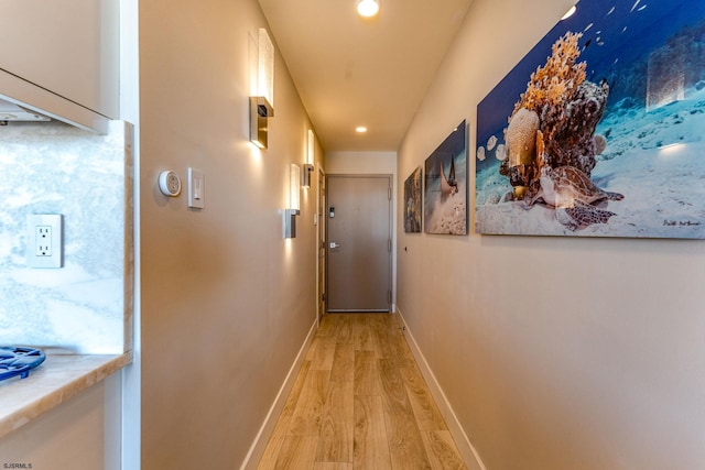 corridor featuring hardwood / wood-style floors