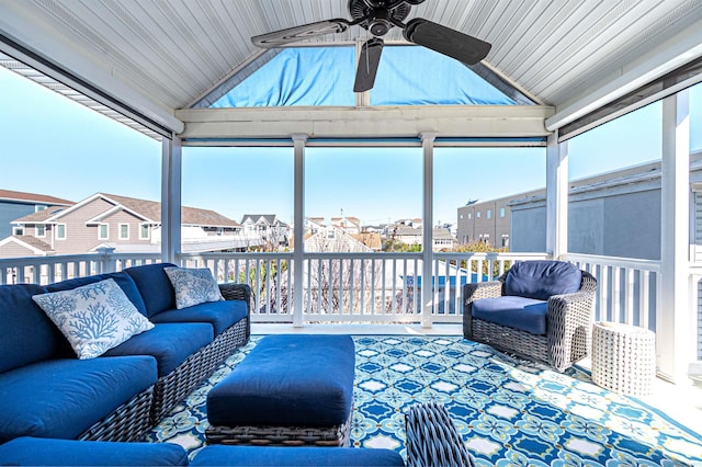 sunroom / solarium with vaulted ceiling and ceiling fan