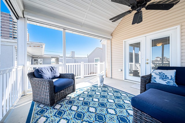 sunroom featuring ceiling fan, french doors, and lofted ceiling