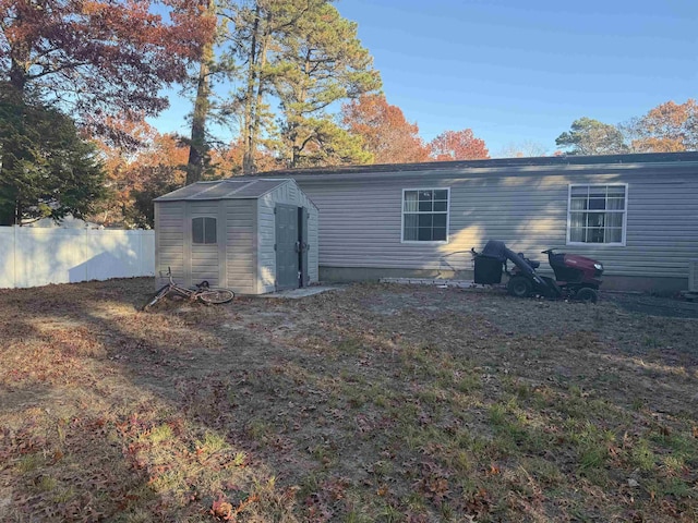 back of property with a storage unit