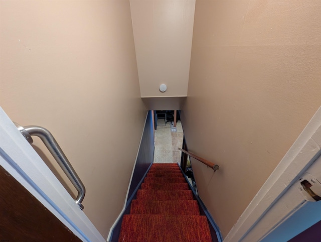 stairway with baseboards