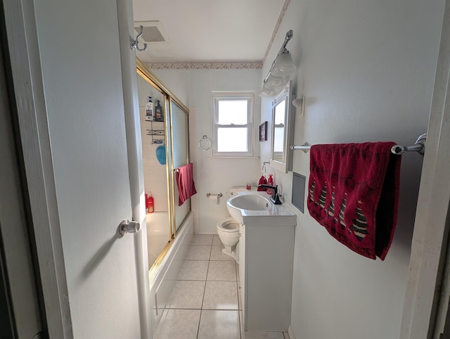 bathroom featuring visible vents, toilet, shower / bath combination with glass door, tile patterned flooring, and vanity