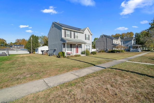 view of front facade with solar panels, a porch, and a front lawn