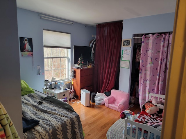 bedroom featuring wood finished floors