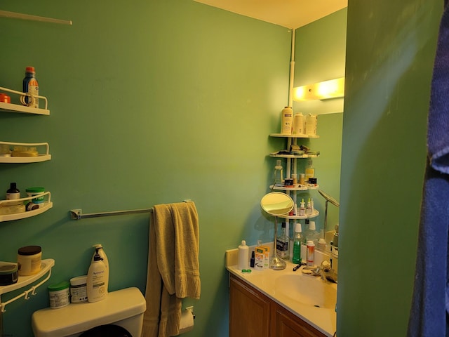 bathroom featuring toilet and vanity