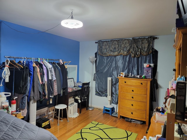 bedroom featuring wood finished floors