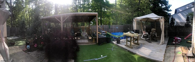 view of playground featuring a yard and a fenced backyard