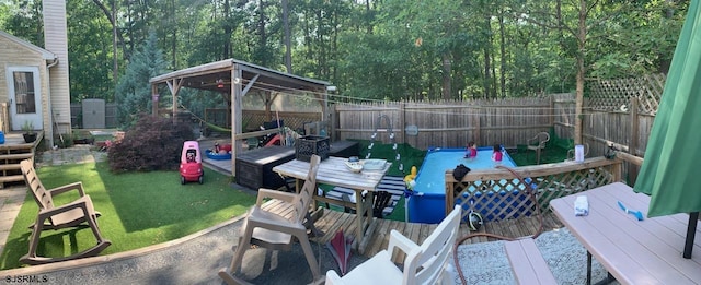 exterior space featuring fence and a deck