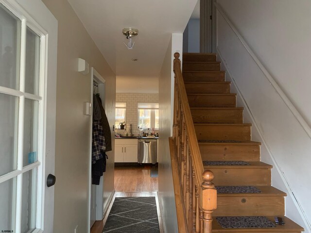 staircase featuring wood finished floors