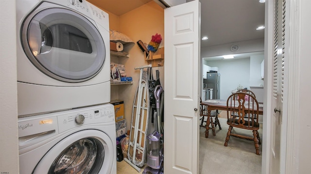 washroom featuring stacked washer / dryer