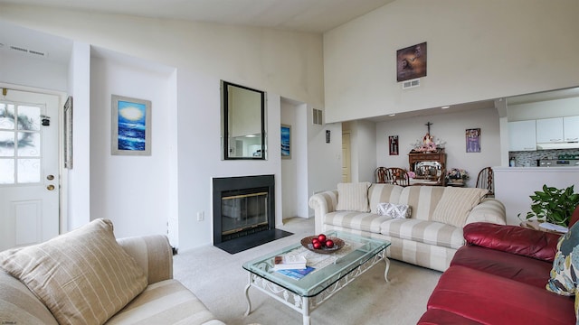 living room with carpet flooring and vaulted ceiling