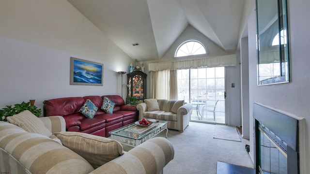 living room featuring lofted ceiling and light carpet