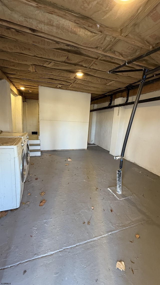 basement with washing machine and clothes dryer