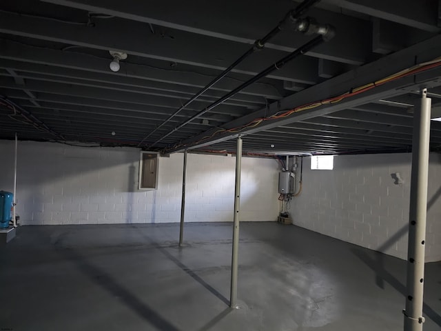 basement with electric panel and water heater