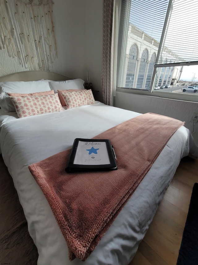 bedroom with wood-type flooring