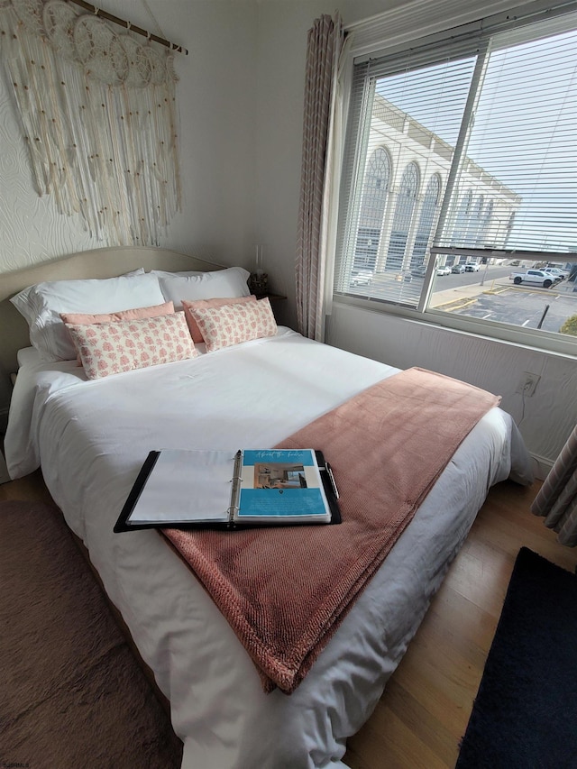 bedroom with hardwood / wood-style floors