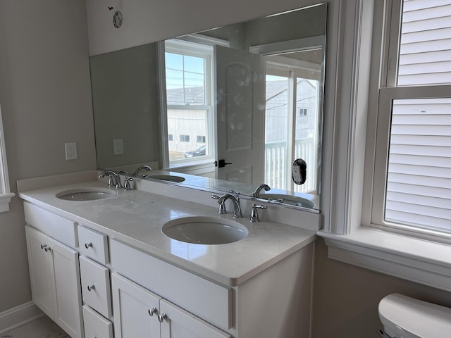 bathroom featuring vanity and toilet