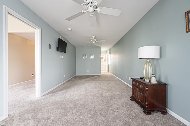 interior space with ceiling fan