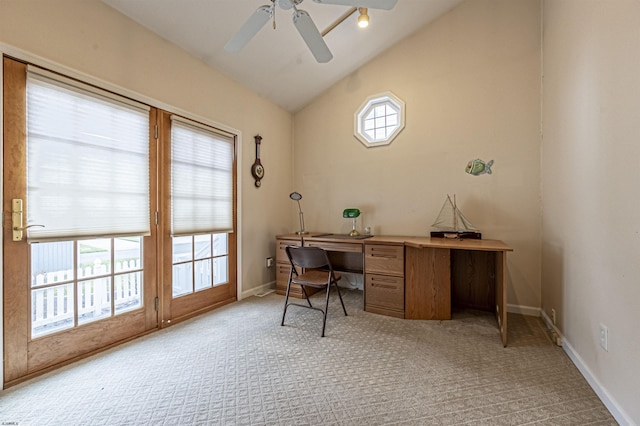 carpeted office space with ceiling fan and lofted ceiling