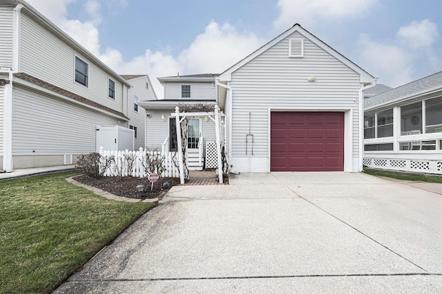 front of property with a front yard and a garage