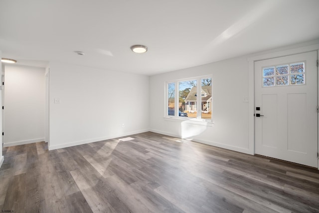 foyer entrance with dark hardwood / wood-style flooring