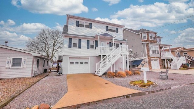 view of front of house featuring a porch and a garage