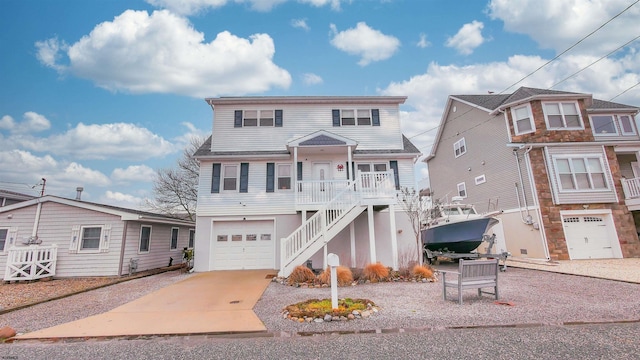 view of front facade featuring a porch and a garage