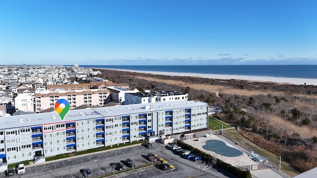 aerial view featuring a water view and a beach view